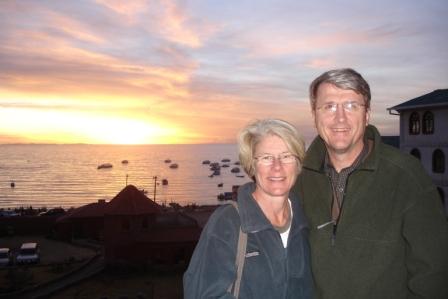 Mom and Dad with sunset over Lake Titicaca